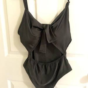 Black one piece with cutout